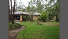  17 King Parrot Parade Gulmarrad NSW 2463 SURROUND YOURSELF With GARDENS & TREES This four bedroom home is positioned to take full advantage of mature shade trees in summer .  As you walk though the front door you appreciate a well designed home where all the bedrooms are separated . With the two living spaces the dining and kitchen separated from the lounge with both enjoying three floor to ceiling windows with roman blinds  Other features are , double lock up garage with sink, 2 bay shed with power and phone line, separate screened BBQ hut with power and water, mature gardens with drip feed irrigation and a battle axe block for privacy 