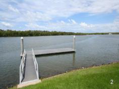 Lot 29, 2078 The Circle Sanctuary Cove Qld 4212 Set among a community of exclusive residences on highly desirable 
Schotia Island, this superb 1,097 square metre well-proportioned 
waterfront allotment offers the last opportunity to build your ideal 
home on the eastern end of the Schotia Islands parklands precinct. 

 Gently sloping to a generous 29.5 metre waterfront with a large 12 
metre deep water pontoon and offering sweeping views to a nature reserve
 on the opposite bank of a wide waterway, this allotment affords its new
 owners bridge free access to the Broadwater and the open ocean beyond, 
making it an ideal location for those wishing to enjoy the boating 
lifestyle. 

 With deep 43 metre side boundaries and a 22.3 metre street frontage 
which faces onto expansive parklands, this allotment assures its owners 
of plenty of space and privacy for their new home. 

 As the last of the east facing wide waterway blocks in the precinct, 
this select waterfront allotment offers a unique opportunity to build 
your own personalized home in a premier waterfront precinct within the 
resort. Alternately, a full set of approved architect design drawings 
for a substantial two storey home is available by negotiation. 

 The Sanctuary Cove lifestyle offers secure and relaxed living centred
 around one of Australia’s finest marina villages with a wide range of 
specialty shops, cafes, bars and restaurants as well as a post office, 
bank, pharmacy and medical centre, all within a buggy ride of the secure
 residential precincts. 

 The benefits of being a member of the Sanctuary Cove community 
include access to two championship golf courses, an exclusive Golf Club,
 a modern Country Club with gym, pool, sauna and dining facilities as 
well as tennis courts and a golf practice range. Residents also have 
access to the dining and recreational facilities of the InterContinental
 Hotel Sanctuary Cove. 

 With the peace of mind which comes from living in an exclusive 
community covered by 24 / 7 land and water security patrols, back to 
base alarm systems and emergency medical attention call buttons in every
 home, the Sanctuary Cove residential resort offers simply the best of 
all lifestyles. 

 © The material in this listing is copyright. Apart from fair dealing
 for the purpose of private use or research, as permitted under the 
Copyright Act, no part may be reproduced by any process without the 
permission of Brett Hughes Marketing Quality Property Pty Ltd. 