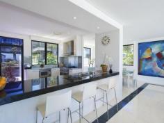  6 Seaforth Cres Seaforth NSW 2092 Party Time On Seaforth Bluff 
 Capturing stunning views that span Middle Harbour, The Spit and 
Sydney Heads, while boasting designer finishes and an intelligent layout
 comprising a variety of outdoor spaces, this family home on 703sqm is 
ideal for the sophisticated entertainer. 
 
The kitchen nods to the owners' hospitality background, with subtle 
enhancements that make it a joy for any chef. The feature granite 
bench-top is complemented by a stainless steel prep bench and sink area;
 an Ilve industrial double oven and 5 burner gas top with Teppenyaki 
plate add to the flair; and a substantial walk-in pantry houses all the 
right ingredients. 
 
The kitchen integrates with dining and formal living areas that flow 
onto an impressive11x3m glassed terrace framing panoramic water views. 
Serviced by a full wet bar complete with fridges, bench-tops and 
shelving alongside surround sound speakers and retractable film screen 
and projector, this upper level offers the grandest host every 
opportunity to boast impressive parties. 
 
Additional north-west terraces on the upper and lower floors face 
sizeable rear lawns featuring a sparkling in-ground pool capturing all 
day sun and protected from ocean breezes. The outdoor BBQ terrace 
connects to guest and games rooms - offering easy, comfortable break-out
 zones for larger families and accommodates a variety of guests. 
 
In addition to the guest bedroom and bathroom, there are a further three
 double bedroom on the lower floor, each with walk-in robes and ensuite 
bathrooms. The fifth - master bedroom - sits on the upper floor and 
boasts spectacular views across the Spit Marina. Its walk-in robe keep 
lines clean and sophisticated and its substantial ensuite bathroom 
boasts double shower, double sink, jet spa bath, WC and bidet. 
 
At street level there's a double secure garage plus an incredibly large 
office den and abundant storage including spacious store rooms plus a 
substantial, easily accessible wine cellar. Ample room to house 
everyone's toys. 
 
Polished luxury stone floors under-heated throughout, sit alongside 
streamlined integrated cabinetry and polished timber floors to ensure a 
fuss-free, modern home that's simple to maintain and is extremely 
hard-wearing. State of the art c-bus installed automation and powered 
blinds complete the many features of this home. While easily able to 
accommodate an expansive family, this home's clever design offers a 
series of connected, warm, living spaces in which larger group can 
gather or find spaces to break-out. Read more at http://seaforth.ljhooker.com.au/DUJF78#8HXD7YSBBIm6WUDI.99 