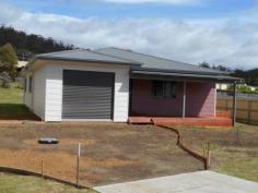  15 Strawberry Hill Court Orford Tas 7190 Newly Completed Quality Home Fancy having a brand new, quality home in a quiet cul-de-sac, close by the beach?  This newly completed property has a spacious, central lounge, dining/ kitchen area opening onto a sunny, side deck. The modern kitchen has a gas cook top,electric oven and eye catching lime green splash back and laminate bench tops.  The bedrooms are carpeted, bathroom, ensuite and laundry tiled, with all other areas having floating floor which is ideal for low maintenance being near the beach. Separate laundry with large storage cupboards opens onto a generous rear yard. All bedrooms have walk-in robes and the main also has an ensuite with quality fittings. The single garage with remote control door, has a door through to the house and could also suit as a rumpus or second lounge. Windows are double glazed and have fly screens. New fences have been erected, front entrance will be cemented and driveway to the rear yard will be finished with gravel. Perfect as either a holiday home or residence, treat yourself to a brand new property just a short walk to the beach, school, shops and cafes. 