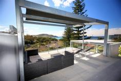  1/7 Red Gum Rd Boomerang Beach NSW 2428 Stunning Ocean View Apartment Tri level, comtemporary beachside apartment Four bedrooms, three bathrooms, double garage Bright open plan living area with stylish kitchen Quality appointments with fabulous rooftop terrace Great location just 80m back from the beach Established holiday rental ~ Boomerang Breeze 1 Pacific Palms Signature Properties have just listed an absolute stunner in the form of this contemporary tri level, beachside apartment that boasts fabulous NE views of Boomerang Beach.Completely renovated and modernised with quality appointments, this striking property stands just 80m back from the sought after southern end of the beach where more often than not, the iconic right hand point break delivers high class waves.With a list of features sure to impress even the most discerning of purchasers, the property comprises of four bedrooms, three bathrooms, a stylish kitchen and a sun drenched living area that opens out to the tiled balcony.However, the most unique feature is surely the open roof top terrace, where the view of Boomerang Beach becomes a great excuse to invite and entertain family, friends and guests who will surely be just a tad' green with envy!With the renowned restaurant Buddha by the Beach across the road and the local Blueys shops and cafes just over hill via a 5 minute stroll, this is modern beachside living at its best.For all details please contact Greg Hope on 6554 0666 or Mark Lawson on 6554 0600. 