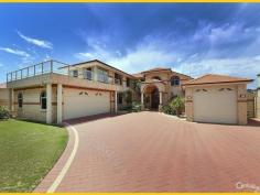  15 Clarecastle Retreat Mindarie WA 6030 EXECUTIVE MARINA LIFESTYLE LIVING THE BEST OF BOTH WORLDS  On Mindarie's most exclusive premier street with beaches literally at your door step this Executive home is in the perfect location ideal for the perfect lifestyle and with dual waterside frontages. This double storey manor has all you could want. Containing 5 Bedrooms (with both Kingsize Master bedroom & "new" Guest Bedrooms upstairs & remaining 3 minor bedrooms downstairs), 4 Bathrooms, 4 separate Living areas - Formal Lounge, Family / Sun room to ground floor and Sitting/Lounge retreat and separate Guest Living area to upstairs, Study, downstairs Dining/Meals area adjacent to centrally positioned large country Kitchen. An upstairs front balcony provides ocean views whilst the rear patio & living overlook the Marina, the private pool and private boat mooring.  View online or simply contact the agent for a complete list of inside features. In summary; you won't be disappointed by the fine finishings, fittings, fixtures and treatments t/out this lovely home. Starting with the Grand Entry leading through to main downstairs Living areas, the passages & Living areas downstairs are all tiled with ceramic tiles with the remaining Bedrooms and upstairs Living areas finished off with quality carpets. High ceilings dominate the home and include decorative bulkhead and ornate cornicing. Other features include; all ducted evaporative & a single split reverse cycle A/C, ducted vacuum Valet & Security Alarm systems t/out, carpeted stairs with steel balustrade leading to upstairs Living, Master & Guest Bedrooms & Study. The country style Kitchen is complete with; a range of quality appliances, Corian tops, dishwasher to stay, plenty of storage and much more.  Outside features are many and can also be viewed in detail online. Key features; access to outdoor areas via the Family room leading to; a covered paved patio area (with Café blinds) and down again to the lower boat mooring decks. The other side of the home allows for an additional covered entertainment area, with Ocean & Marina views from the various vantage points including the large balcony over the front garage - with views to Quinns Beach. Your exclusive Boat Mooring can be seen from the perfectly positioned rear Living areas - all with captivating views. The backyard is all easy care paved with terraced landings and pebble gardens back & front—all well established, reticulated and with some water features. To the front is a double auto lock-up garage + extra space behind front fully enclosed courtyard with auto steel gates, in addition there is a large boat store / 3rd garage / workshop with ample storage ideal for any large vehicle / good sized boat. This beautiful home is contained on a large 1,174 sqms terraced block - opp walkways to Mindarie/Quinns Beach and surrounded by other similarly priced & exclusive homes.  This home must be viewed to be fully appreciated therefore contact Ray to view strictly by appt today.  