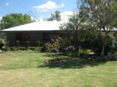  7 HANLEY LANE Murgon QLD 4605 THREE BEDROOM BRICK HOME IN A QUIET CUL DE SAC This solid built brick veneer home is looking for a new owner. Enter through the front door into the tiled lounge/ dining & kitchen area. There is an adjoing garage attached to the house which allows you to enter the house straight into the kitchen. Brand new stainless steel electric stove with a matching rangehood. Three carpeted bedrooms two of which have built in cupboards. Set of hallway cupboards, & the bathroom features a shower & bath combined with a separate toilet. The laundry is a very spacious room with ample space for some extra cupboards. Step outside to a tiled entertainment area which is also handy to keep the little ones in. At the back of the yard is a concreted & powered garden shed for the gardening tools & then there is the real shed, two bays with a workshop, 15 amp plug for welding, remote control roller doors a 4 sets of new fluro lights. This home also has a rain water tank at the back of the property which is filled from both the shed & house, complete with pressure pump & the ability to turn the valve to run on either tank or town water. This house is well worth a look & the owner is motivated to sell. General Features Property Type: House Bedrooms: 3 Bathrooms: 1 Land Size: 918 m² (approx) Price per m²: $223 Indoor Features Living Areas: 1 Toilets: 1 Built-in Wardrobes Outdoor Features Remote Garage Garage Spaces: 3 Outdoor Entertaining Area Shed Eco Friendly Features Water Tank $205,000 
