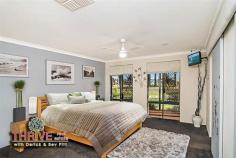 2 Kinship Way Atwell WA 6164 DESIGNER FAMILY HOME...PICTURESQUE PARKLAND VISTA! Web property id:  TRE147 Set in the award winning Harvest Lakes Estate is this former display home, built by the highly regarded Rural Building Company with approx 250sqm of internal living space on a large 769sqm corner block and showcasing stunning parkland views that enhance ambience and appeal, in this truly gorgeous home. With a fantastic well thought-out family-friendly floor plan promoting great separation of living, with the parents’ wing on the opposite side of the home to the childrens’ wing, this home is complete with four bedrooms, office, kids activity, two bathrooms, multiple living areas including home cinema, galley style kitchen, large laundry, timber decking, alfresco Balinese style hut, and double lock up garage. The centre of the home is the massive open plan living and dining area with a striking Toodyay stone gas log fireplace, Marri timber floors, 11 metre wide raked ceilings with exposed beam and a delightful views over opposite parkland including its Cypress Pines...what an enchanting vista! A galley style kitchen is also central to the home and is equipped with Essa stone benchtops, stainless steel appliances including a dishwasher, gas hotplate, tiled splashback and abundance of storage cupboards. You’ll never need to visit a Hoyts cinema again with this impressive fully equipped home cinema to watch your favourite shows, the latest blockbusters and sporting fixtures...just bring the popcorn, dim the lights, let the show begin! The childrens’ wing also has its own play room/activity centre, well away from rest of house and central to their bedrooms – a great space for bookshelves, toys, their own TV or homework zone. Other features include: two evaporative ducted air-conditioners, recessed lighting, quality carpets, inbuilt speakers, intelligent wiring, solar panels, solar hot water system, security alarm, auto reticulation in garden and alfresco timber decked areas for entertaining and relaxation. Outside the home has fully landscaped gardens with ample room for a pool...the inviting and intimate resort-style Balinese hut is the ultimate place for a Sunday afternoon beer, wine or cocktail with family and friends.  Located in a family friendly, master planned community close to amenities and surrounded by quality homes; within walking distance to both Harmony Primary School and Atwell High, it’s an extremely convenient and appealing home, built to facilitate a relaxed WA lifestyle in comfort and style. Highly motivated owner has priced this home for immediate sale so here is your opportunity to own this unique family home with its lush green parkland vista in this highly sought after location...so act immediately! For more information on this magnificent home or to arrange your private viewing please contact Derick and Bev PITT from THRIVE Real Estate on 0438 011 690 or 9414 9440. 