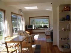  235 Curricabark GLOUCESTER NSW 2422 $499,000 Set back off the road to give you privacy, peace and quiet and an opportunity for a change of lifestyle, this home is spacious and welcoming. A lovely light and sun filled open plan home with air conditioning and combustion heater for those chilly months. Polished hardwood floors are a feature. The kitchen is well laid out, has a dishwasher and lovely big windows overlooking the lovely rural views. There are three generously sized bedrooms. 3 side wrap deck surrounds and an undercover entertaining area out the front. Freestanding four car garage and 100,000 litre water storage, and solar power, this home is almost fully self-sufficient. Ample water storage = no water rates Solar power panels and solar hot water = minimum electricity bills Fully electric = no gas bills 