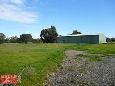  1973 Great Northern Hwy Bullsbrook WA 6084 Perfectly positioned on the south side of Bullsbrook, is this superb piece of Australian land. With
 flat land adjoining the highway there is enough space to have a buffer 
zone from the main part of the block. The block is separated by a brook 
and the back part of the property is gently sloping in some parts and 
lightly treed. The standout feature of the property is the 
MASSIVE workshop with an office space and full bathroom all inside. 
Outside there are also small carriage like rooms which could also be 
used as extra workspace as there is one that's just a room, one that is a
 room...
 
 
 