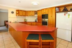  22 Kauri Court Bonogin QLD 4213 LARGE FAMILY HOME - ENTERTAINERS DREAM Set on an almost fully fenced and elevated 3000m2 block, this immaculately presented 4 bedroom plus study home will meet the requirements of a large family who require space with both house and land.  Features include: * Air conditioned main bedroom with ensuite and large wardrobes * Separate formal and informal living and dining areas * Spacious kitchen with outlook to rear of property * Woodburner * Huge laundry * Massive outdoor covered deck * Inground pool with pool safety certification * Side access on both sides of house * Elevated with wide hinterland views * Plenty of room for a shed * Landscaped gardens Simply move in and put your feet up as all the hard work has been done including new carpets and interior paint throughout. Book your inspection today. View Sold Properties for this Location View Auction Results General Features Property Type: House Bedrooms: 4 Bathrooms: 3 Land Size: 3000 m² (approx) Outdoor Features Garage Spaces: 2 Swimming Pool - Inground Offers above $675,000 