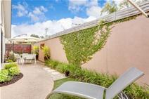  2/3-5 Brendel Street, Rosebud West VIC 3940 Offers over $395,000 Built only 5 yrs ago by one of the peninsula’s leading builders, with an architectural influence and crisp clean lines in its design. This sensational single level townhouse is situated only 150 metres from the sandy shores of Port Phillip Bay, with walking and bike trails meandering along the foreshore from Rye to Safety Beach and a popular shopping strip offering restaurants, cafes and specialty shops. A sun drenched open plan living and dining area with high vaulted ceilings adjoins the magnificent kitchen with Cesar stone bench tops, marine ply cabinetry and top quality European appliances. Featuring 2 good size bedrooms with (BIR'S), luxurious fully tiled bathroom complete with separate shower, vanity and relaxing spa bath, imported tiles, polished timber floors and quality fittings throughout. After a quick walk back from the beach, laze the day away in the private outdoor entertaining and BBQ area with landscaped coastal gardens. Internal access and remote garage makes this the complete package and well worth your personal inspection. 