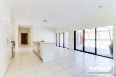  18 Waterbury Street Cranbourne VIC 3977 Ex-display modern inspired living showcases design excellence thru this four bedroom plus entertainer's floor plan. Without compromise this immaculate family home offers spacious formal and informal living, generous robed bedrooms with a stunning kitchen and dining area. 560 square metre allotment, remote control double lock up garage with rear access, ducted heating/cooling, alarm, led downlights , caesarstone bench tops to kitchen and vanity top to bathrooms and heaps of extras this superbly located home in the Carlisle Park Estate! With a bus stop nearby, only moments from Primary School and Lyndhurst College, short drive to Monash freeway entrance, minute's walk from the Shopping precinct this family home has been designed ready for you to enjoy your lifestyle NOW! - See more at: http://cranbourne.harcourts.com.au/Property/587805/VCR24676/18-Waterbury-Street#sthash.xCS4XMI1.dpuf 