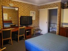  00 Acacia Motor Inn Armidale NSW 2350 The Complete Package - Armidale Freehold Motor Inn Ever dreamt of owning your own motor inn? This is a rare opportunity to purchase a long established family business and free hold. Boasting a great location midway between the highway and CBD, this well maintained motor inn offers quiet and convenient accommodation for business travellers, families and visitors. The property is set on a huge 5607sqm block and comprises 15 single storey guest rooms, three bedroom managers residence, recreation room, outdoor bbq area, reception, commercial kitchen and adequate car parking. The comfortable guest rooms are spacious and designed to accommodate a variety of guests including double, twin and family set-ups plus a disabled suite. All rooms are fully equipped with ensuite, television with Austar, tea and coffee making facilities, telephone and reverse cycle air conditioner. Price: $1,500,000 + stock at valuation + GST if applicable The Motor Inn is offered for sale on a WIWO basis. Please contact Peter Georkas on 02 6772 5333 for more information. View Sold Properties for this Location View Auction Results General Features Property Type: Unitblock Bedrooms: 18 Bathrooms: 16 Indoor Features Ensuite: 1 $1,500,000 