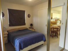  N4 White Albatross Nambucca Heads NSW 2448 Entry to this home is via a glass sliding door from a private front verandah, located in the White Albatross Over 50's Park at the entrance of the beautiful Nambucca River. A fresh feel to the lounge room on entry has glass mirrored tiles giving length to the room. The lounge and dining with new carpet underfoot flows through to the kitchen, with the added comfort of air conditioning. The kitchen with new timber look a like vinyl flooring, comprises of electric upright cooker and range hood. Adjacent to the lounge is the 2nd bedroom with glass sliding doors to a back verandah. This room also has direct access to the bathroom as does the main bedroom. Leading from the dining room, with new carpet and mirrored built in robes is the main bedroom. The bathroom come laundry, has a toilet, vanity, shower and linen cupboard. There is convenient room for a washing machine within this area. Externally the property has a single carport, with paving to the rear. A covered back verandah has shade cloth blinds and a great area to hang washing on a rainy day. Step down to a delightfully maintained lawn area with bush further a field, this outlook is definitely a feature of the property.  