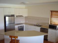  57 First Avenue,		WOODGATE QLD 4660 $599,000 FULLY FURNISHED EXECUTIVE CLASS RESIDENCE approx 100 metres from the beach at DESIRABLE WOODGATE BEACH. The FULLY FURNISHED property is situated in First Avenue, with an adjacent walkway providing quick beach access - feet in the water in about two minutes. The residence is the northern of the two units, and captures cooling sea breezes in summer and plenty of winter sunshine on the north-east facing top deck. The Woodgate Beach Hotel with restaurant is about a five minute leisurely stroll as is the direct to ocean boatramp. Theodolite Creek, the mighty Burrum River, and the National Parkland boardwalk and hiking tracks are all just a few minutes drive away. The FURNISHED unit would well suit owner occupier,or alternatively, be an excellent letting property for holiday makers. The rear yard is fenced. THE RESIDENCE FEATURES:- Ground Level 