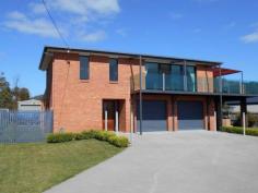  74 West Shelly Rd Orford TAS 7190 West Shelly - Just Move in! A remote control gate and a neat, cement driveway lined with pretty shrubs and manicured lawns lead to this generous home, offered fully furnished, set over two levels and wonderfully located opposite West Shelly Beach. The upper level, with beautiful views over the bay, has a large carpeted lounge/dining area, an eye-catching Myrtle kitchen with polished Tas Oak floor boards and two bedrooms , the main with an ensuite. The front deck has green glass panels and balustrade posts with built in lights - very pretty at night. The entrance level with polished floorboards, includes a brand new bathroom with spa bath and separate shower, separate laundry, toilet with vanity, small sunroom, two bedrooms and a large ,double garage which could also be a great rumpus/ games room. At rear is a tractor shed/second garage and level, fenced grassed yard with an undercover BBQ area to the side of the residence. This well presented property only metres from the beach and just a short walk or ride to the Orford shops and cafes is currently a very comfortable residence but could also suit as a holiday home with plenty of room for the extended family or perhaps two families . A wonderful opportunity at West Shelly Beach, only one hour’s drive from Hobart. 