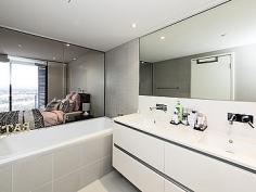 Ultimate Lifestyle - See Video Tour!! This immaculate 15th floor apartment offers the ultimate lifestyle. Enjoy stunning, panoramic views from the open plan living and dining areas which flow seamlessly to the balcony, providing an abundance of natural light and fresh air. This is the perfect place to relax at the end of the day, taking in the stunning river and hill views. Quality finishes feature throughout including a stylish kitchen with stone bench tops, built-in dishwasher, stainless steel European appliances and plenty of storage space. The master bedroom has a large, built-in wardrobe and ensuite with bath,... 