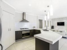  13 Drysdale Cres Point Cook VIC 3030 The ultimate entertainer!LJ Hooker Point Cook presents 13 Drysdale Crescent, Point Cook. Showcasing high-end quality with striking features, this home will quickly make you the envy of family and friends. Feel like you're on holiday all year-round by taking advantage of diverse entertaining options, including an alfresco, deck and L-shaped swimming pool set within established gardens. Inspect at this Saturday's open or contact the agent for more information.  - Featuring four bedrooms plus separate study, including a large master bedroom with parents' retreat, his/her walk in robes and a stylish en suite with twin vanity and oversized shower. - Bedrooms two, three and four are located down a separate hallway and are all equipped with built in robes. - Spacious living areas are well positioned, including a home cinema room with double door entry, open plan dining/family area adjacent the kitchen and a large living room overlooking the pool and garden. - Designer kitchen complete with elongated bench tops, stainless steel appliances including under bench oven, gas cooktop and range hood, glass splash back, dishwasher, walk in pantry, good-sized fridge cavity and feature lighting. - Glass sliding doors from the family room open up to a paved alfresco and separate deck, offering multiple entertaining options all-year round. - Large grassed area and established planting surround the custom-designed swimming pool with mood lighting and water feature all set on a generous 645m2 block (approx). - Multitude of luxury features including double garage with remote control, ducted heating, evaporative cooling, two stacked stone feature walls complete with down lights, high ceilings and quality window furnishings. Located only 22km from Melbourne's CBD in Innisfail estate, this home is conveniently located near parks and playgrounds, childcare, primary and secondary schools. Within walking distance to local amenities including Boardwalk Central shopping centre and a short drive to Point Cook Town centre and Williams Landing train station, this home is sure to impress. 