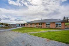 34 Laytons Road Sidmouth TAS 7270 Great Land, Great Home, Great Lifestyle Overlooking undulating pasture and capturing vast views of green fields, this 21.76 Ha (approx. 53 acres) property is the epitome of life in the Tamar Valley. With a combination of an eco-friendly, near new 4-5 bedroom home, built in 2013, ample water supply, mostly pasture with light bush and good outbuildings, country living surely couldn’t get any better than this? The current owners have endeavoured to make the modern home as self-sufficient as possible. They don’t pay anything for power, water or sewerage. There are 22 solar panels, solar hot water, double glazing, floor, ceiling and wall insulation, 4 dams (2 spring fed) and 2x 23,600L water tanks. The property has a fire zone rating of 1 even though there is a patch of trees to cut your own wood and various fruit trees and vegie beds will ensure an upcoming harvest. With 4 paddocks, each with their own water supply, it’s up to you what you run. Currently being used for horses and a few cattle although your options are endless with the addition of cattle yards, which easily converts to a round yard, vet cattle crush and loading ramp, 3 bay machinery shed, double garage and workshop. A 40 foot container with power and water is currently being used as a tack room and you will also find a dog run, wood shed plus private paved courtyard for summer dining. The interior of the home is light, bright and spacious. The kitchen has all the features including soft close cabinetry, stainless steel appliances, a 900mm oven with gas cooktop.  2 living areas ensure entertaining flexibility with a modern dcor running throughout the rest of the home. This is a very rare combination of home, land and lifestyle to come onto the market and we welcome your inspection today! 
