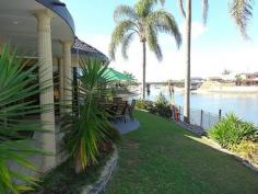  52 Walter Raleigh Cr Hollywell QLD 4216 HUGE PRICE REDUCTION - MUST SELL NOW! Owners relocating and price drastically reduced by $100,000 for immediate sale. Bright & airy 4 bedroom, 4 bathroom waterfront family home on 848m2 block located in a quiet cul-de-sac offering 34 meters wide water frontage and only a short cruise by boat to the Broadwater and seaway. Many features including:- * Open plan living areas with amazing wide water views * Floor to ceiling butt-glass windows and 10ft high ceilings * Four bedrooms with waterfront king-size master suite * Master suite with his & hers ensuite and private robes * Four bathrooms including an entertaining area bathroom * New main bathroom with double vanity, spa bath and shower * New kitchen with Caesar stone tops & quality appliances * Soft close drawers, dishwasher and space for large fridge  * Ducted air-conditioning and remote ceiling fans throughout * Separate entertaining area with private saltwater pool * Wet bar with stone bench top on the waterfront * Waterfront entertaining area with lawn * 9m pontoon with concrete pylons, power & water * Double garage plus room for 2 extra cars * Workshop/storage room and large attic . General Features Property Type: House Bedrooms: 4 Bathrooms: 4 Land Size: 848 m² (approx) Indoor Features Ensuite: 1 Study Outdoor Features Carport Spaces: 2 Garage Spaces: 2 $975,000 
