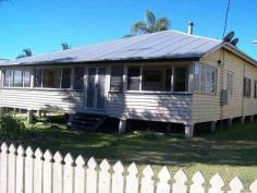  18 Kent Street Bororen QLD 4678 ABSOLUTE BARGAIN! This cosy timber Queenslander home is situated close to the local Bororen School and is within a short stroll to the shops.  Stepping up 4 steps you are greeted in an enclosed sunroom that offers great extra living space. Down the hallway it opens up into the living and dining area that features an combustion heater. The kitchen is tucked away just off from the living and dining area and offers timber bench tops, free standing oven, breakfast bar window.  Two large bedrooms with built in robes and one fitted with air conditioning. Extra bedrooms have been made to suit your family. Vibrant large bathroom provides bath, separate shower & ample storage space. Outside features a huge undercover entertainment area that flows seamlessly into the backyard. Above ground pool and rock fire BBQ is great for those hot summer days shared with friends and family. Tranquil pond with small bridge leaping over it, adds that extra special touch! Side access with extra shed space at the rear and single carport tops it off. Easy access to the Highway and a 25 minute drive to Tannum Sands. View Sold Properties for this Location View Auction Results General Features Property Type: House Bedrooms: 2 Bathrooms: 1 Land Size: 1100 m² (approx) Outdoor Features Garage Spaces: 1 Swimming Pool - Above Ground Other Features Above Ground Pool, Close to Schools, Entertaining Area, Established Gardens, External Water Feature $222,000 