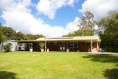  30 Witta Road Maleny Qld 4552 Set at the rear of this 7589m2 block (almost 2 acres) this low set brick
 home has been specifically sited to take advantage of the expansive 
north facing views. This is a very special piece of land and subject to 
new Council regulations and approvals a second dwelling may be 
permitted. The existing home has four large bedrooms all with built-ins.
 Huge views from the kitchen which is combined with the family meals 
area and the separate lounge room has a pot belly stove. There is a 
large laundry and utility area with good storage. The spacious rear 
entertainment area takes advantage of the magnificent outlook. There is a
 20,000 gallon water supply, lock up garage, steel shed & undercover
 caravan parking. There is also plenty of room to keep horses other 
anaimlas or build a huge shed. Less than 10 minutes drive into Maleny 
privacy is guaranteed at this address. 