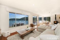  82 Araluen Drive Hardys Bay NSW 2257 FOR SALE: OFFERS OVER $1,200,000  Property Description You'll be impressed! This tri level residence occupies a prized Hardys Bay waterfront reserve position and showcases commanding 180 degree views across the bay to the Rip Bridge and beyond. An abundance of light and space define this home, with open plan living and dining with timber flooring and combustion fire. Offering spacious bedrooms, a bunkroom/rumpus and separate flat downstairs with private entry, so there’s plenty of accommodation. BBQ with family and friends on the front patio and enjoy the bay views or in the paved rear courtyard that overlooks the grassed backyard. Located a short walk to the restaurants, cafes and shops of Hardys Bay and only a short drive to Killcare Beach. This is the ideal lifestyle property and perfect opportunity to invest in this prestigious coastal location less than an hour from Sydney. Property Features Land Area 	 986.0 sqm 
