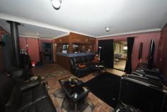  6 Bullock Ave Chester Hill NSW 2162 Auction 29/11/2014 at 11:30 AM Property: House 	 Bldg: Aluminium Clad 	 Land: 626 Sqm 	 Council: Bankstown 	 Age: 65 	 Rooms: Lounge/Living Family Room Dining Room 	 Other Areas: Laundry Area- Internal Balcony(s) Pergola 	 Local Amen: Schools Railway Station Bus Service Shops Sports Field & Club Child Care Centre Playground Park 	 Zoning: RESIDENTIAL 	 Furnished: N FAMILY HOME IN A FAMILY LOCATION. A spacious tidy clad house situated on the higher side of the street in a lovely whisper quiet cul-de-sac. The home provides three (3) bedrooms with one having a built-in robe. There is a separate lounge leading to a dining room onto an updated kitchen. Provides two (2) modern bathrooms, one (1) of which has a corner spa bath. For the entertainer this home boasts a large rear family room that features a fantastic timber wet bar, air conditioner and a fireplace, making it an all year round sensation. There is a partly screen enclosed patio and a pergola off the back laundry. Has a wide driveway through a double carport into a single lock up garage with a storage loft. Quietly nestled in a lovely quiet cul-de-sac, ideal for the young family and on a 626m2 block. Has dimensions Irr 17.07/28.04 x 29.72/27.58m. 