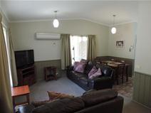  6/16-10 Gavan Street, Bright VIC 3741 REDECORATED & STYLISH - UNIT 6 ‘SILVER BIRCHES’ $275,000 This delightful unit in the Silver Birches complex has recently been very tastefully redecorated and renewed. Comprising an open plan lounge, dining & kitchen area, 2 bedrooms with BIR’s, modern bathroom, laundry & undercover parking for 1 vehicle. Boasting new carpets, soft furnishings and a modern interior colour scheme. Fully furnished & self contained. In immaculate condition in a superbly presented & well managed holiday unit complex with in-ground pool, outdoor kitchen & dining area. Excellent investment for your own holidays & rental return. 