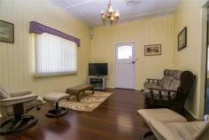  51 Nicholson Street, DALBY, QLD 4405 Here we have a great classic home with T&G Walls, High Ceilings, close to Schools, Shops & directly across the road from the Show Grounds. It features 3 Bedrooms, Main having Bay Window & adjoining Sunroom currently used as an office which could easily be converted into a WIR & Ensuite, or even a 4th Bedroom. 2nd Sunroom would make a great reading room or small Office. Lounge Room & Formal Dining. Large Eat-In Kitchen with extra Living/Dining Area. Evap Air throughout. Shady Outdoor Area, 2 Rainwater Tanks, plumbed through Kitchen & Bathroom, Garden Shed, Single Carport, Fully Fenced ¼ acre block. Call now to book an inspection. $259,000 neg. 