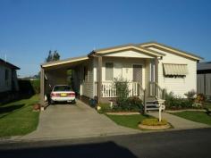  56 Bangalow Crescent Gateway Village,Grafton NSW 2460 A delightful 2-bedroom residence presented in immaculate order and superbly located within the park.  Features include: a large living room; dining area off the kitchen; oodles of bench and cupboard space with the kitchen; both bedrooms are well sized and have built-in robes; a big bathroom with a handy over-sized shower recess; front and back verandahs; nice yard space. Extras include air-conditioning and ceiling fans. The back verandah takes a north east aspect - plenty of lovely summer breezes enjoyed here. Servicing the residence is a large carport with lock-up storage room. The Gateway Village is a top quality managed residential park. Manicured grounds and gardens create a beautiful living environment for the residents. The park's website is - www.thegatewayvillage.com.au 