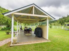  1179 Kilcoy-Beerwah Rd Cedarton QLD 4514 Located in a Lush Fertile Private Valley Between Peachester & Woodford * Permanent Flowing Creek that Runs almost the Full Length of the Property * Water Provision for Internal Paddocks from 5,000 Gal Header Tank * Five Paddocks with Barb & Electric Fencing * Cattle Yards with all Weather Crush * Machinery Shed plus 9mt x 6mt Shed * Private All Weather Road has 2klm of Post & Rail Fencing * Magnificent High Set Sandstone Brick Mansion * Grand Entrance Vestibule with Cathedral Ceiling & Crystal Chandelier * Timber Staircase opens onto a Formal Lounge with 11ft Ceilings Featuring A Beautiful Chandelier * Upstairs Living (390m2 incl Balconies & Verandas) * Spacious Lavish Master Bedroom has W.I.R & Ensuite * Guest Bedroom with Ensuite plus Two other Bathrooms & an Office / Sitting / Reading Room * Gourmet Kitchen with Gas Cooking & Dishwasher * Formal Dining & Family Room * Main Bedroom with Claw Foot Bath * Downstairs (300m2) access from Entry Foyer to Large Area which could be Rumpus / Craft Room / Studio or Workshop * Laundry / Toilet / Shower * Large Double Lock up Garage * 2x 5,000 Gal Tanks Connected to the House * Fully Covered Outdoor BBQ Area Completes the Picture * Separately Fenced House Yard Tastefully Landscaped * A Must To Inspect For A Genuine Buyer Looking For The Ultimate Property * Inspections by Appointment Only 