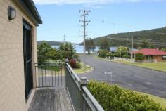  1/1 Windsor Street Tarbuck Bay NSW 2428 Low Maintenance and Lake Views Three bedroom, two bathroom townhouse 100m walk to the lakes edge/boat ramp nearby Level, sunny corner site with low maintenance Open plan tiled living with large kitchen Lake view balcony off master bedroom Under 10 minutes drive to surf beaches This sunny and spacious, two story townhouse is positioned in the charming lakeside village of Tarbuck Bay and as the main picture shows, it is just a couple of stone throws to the waters edge!Just a few minutes drive from local surfing beaches and Smiths Lake bowling club, shops and cafs it features:*** Three bedrooms with built in robes*** Main bedroom with lake view balcony*** Tiled living area with large kitchen*** Main bathroom (pictured) upstairs*** Second toilet/shower next to laundry downstairs*** Easy to maintain level gardens lawns*** Single garage/carport*** Brick veneer construction with colorbond roof*** Existing tenant at $260 p/weekSomewhat of a rare find in this quiet, lakeside setting - the property is priced to sell so be quick!Please call Mark Lawson on 6554 0600 and Greg Hope on 6554 0666. 