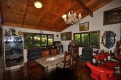  594 Binna Burra Road Beechmont QLD 4211 Picturesque Getaway Located in the mountains of Beechmont is this archtectually designed split level home. Ideal for the whole family, B & B, Holiday Letting etc. Set on 4 acres (16630m2) of ample flora and fauna, ideal privacy. This property boasts: * 5 bedrooms * 3 bathrooms * 4 car garage * 2 carport space * Covered outdoor entertaining area * Inground solar heated swimming pool * Family room on the middle level, for privacy and convenience for the whole family * This home features a warm and inviting feel to it with an abundance of timber used throughout, lets out a country feel to it + combustion fire place * Located only minutes from the local Binna Burra Lodge, approx. 15 minutes from Canungra Township, 30 minutes to Nerang. An inspection will impress. General Features Property Type: House Bedrooms: 5 Bathrooms: 3 Land Size: 1.66ha (4.10 acres) (approx) Indoor Features Ensuite: 1 Toilets: 3 Study Floorboards Broadband Internet Available Built-in Wardrobes Dishwasher Open Fireplace Outdoor Features Secure Parking Carport Spaces: 2 Garage Spaces: 4 Balcony Deck Outdoor Entertaining Area Shed Swimming Pool - Inground Eco Friendly Features Solar Panels Water Tank Greywater System Asking $775,000 