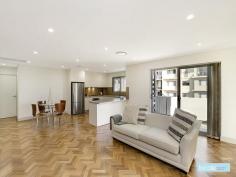  18/100 Tennyson Road Mortlake NSW 2137 Ultra Chic Urban Style This luxury three bedroom apartment captures the essence of contemporary living and presents an opportunity to purchase in a great location. The warm interior and open plan design brings together an expansive sun-filled living and dining area with neutral tones and stylish herringbone patterned timber floors. The gourmet seamless designed kitchen features caesarstone benchtops, abundant cupboard space, coffee toned glass splashback and Miele gas appliances. Keeping the space light and airy, glass doors open onto a wrap around balcony perfectly positioned for afresco dining. From the balcony climb a spiral staircase to the rooftop terrazzo perfect for entertaining with distant water views.  Three deluxe bedrooms with built in robes, main suite features a private balcony and chic ensuite. Fully tiled designer bathroom with stone bench top and contemporary tapware. Other features include security intercom, air conditioning, internal laundry with cupboards and caesarstone benchtop and a double car space with security entrance. Enjoy the lifestyle with cafes, restaurants and local shops close by. Surrounded by spectacular foreshore walkways and the convenience of public ... show more View Sold Properties for this Location View Auction Results General Features Property Type: Unit Bedrooms: 3 Bathrooms: 2 Building Size: 216.00 m² (23 squares) approx Indoor Features Air Conditioning Outdoor Features Garage Spaces: 2 Other Features Built-In Wardrobes,Close to Schools,Close to Shops,Close to Transport,Garden $1,200,000 