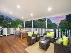  12 Dewar Terrace Sherwood QLD 4075 This beautifully presented, meticulously renovated Queenslander, on a 
wonderful, deep 888m2 flat block, sets the bench mark for fabulous 
family living. The original home dates back to around 1900 and the 
architect has successfully blended classic charm with contemporary 
style. 
 
The main living areas are so generous in space, with their 12ft high VJ 
ceilings, an abundance of windows and floor to ceiling b-fold doors that
 allow a smooth flow, out to the large, covered rear entertainment deck,
 that overlooks the lush flat lawn and rear gardens. 
 
Linked to these living areas is the most marvelous kitchen. From the 
beautiful Caesar stone bench tops, state of the art appliances, wide 
usable work stations, well-crafted cupboards, Butler's sink, and 
Butler's pantry, to the extras that just give this space the 'wow' 
factor. It's the light, the design, the quality of the workmanship that 
makes such a statement. 
 
There a four bedrooms and two bathrooms on this level, with the master 
suite consisting of original French doors opening out to the wide front 
veranda, an extensive walk in robe (with a wardrobe lift) and an 
immaculate ensuite, where the choice of texture and colour blend so well
 with the classic style bedroom. 
 
A wide internal staircase, crafted from beautiful 'Kwila'timbers, with 
an iron balustrade, leads you down to the lower floor, where another 
generous living area, complete with wet bar/mini kitchen allows you to 
entertain in a relaxed manner. Linked to the outdoors via floor to 
ceiling bi-fold timber doors, the room effortlessly spills out to the 
paved patio and the back garden. 
 
This level also incorporates a fifth bedroom/study another elegant 
bathroom, laundry and internal access to a separate storage room (man's 
cave) and extra-large double garage, with automatic doors. The driveway
 has been designed so there is adequate room to turn around. You need 
never have to back out of your driveway again. 
 