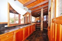  40 Johns Crescent, Mount Evelyn, VIC 3796   $420,000 Plus On Approx Three Quarter Acre There is no other like it! Built with a mix of recycled 100 year old bricks, stone from the site and weatherboards, pieces of an old shearing shed, lead light windows and rough hewn timbers. Timber kitchen overlooks the big deck that sits amongst the greenery for privacy and pretty treed outlook. Open plan lounge with split level to formal dining and a lovely curved staircase to the mezzanine master bedroom and ensuite. Downstairs is a further two bedrooms, with both being double in size and one opening out onto the deck. Large picture windows make the most of the lovely treed outlook, with great out door entertaining on a large deck, overlooking the big, big back yard nicely. (approx 3,000 metre block) The emphasis is on a tranquil lifestyle If you are looking for something very special, and are ready for a renovation project, this home says welcome. 