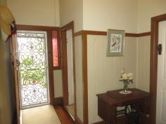  59 King Street GLOUCESTER NSW 2422 $349,000 As you enter this gorgeous character home you are reminded of an era and style of a classic past. There are loads of original features that have been lovingly restored to keep that old world charm with renovated original fireplaces. This substantial property offers a well maintained possible five bedroom family home of generous proportions, and is complimented by the hardwood timber floored and covered outdoor area, which combines indoor and outdoor entertaining. Relax with a glass of wine while watching the kids swim in the in - ground, saltwater pool or watch a movie in the rumpus/ theatre room. The country style kitchen is modern and compliments the timeless beauty of this home. It is large and functional. The combined kitchen and dining area is ideal for everyday living and the second living area includes a spacious family room and formal lounge which completes the package. 