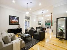  12 Dewar Terrace Sherwood QLD 4075 This beautifully presented, meticulously renovated Queenslander, on a 
wonderful, deep 888m2 flat block, sets the bench mark for fabulous 
family living. The original home dates back to around 1900 and the 
architect has successfully blended classic charm with contemporary 
style. 
 
The main living areas are so generous in space, with their 12ft high VJ 
ceilings, an abundance of windows and floor to ceiling b-fold doors that
 allow a smooth flow, out to the large, covered rear entertainment deck,
 that overlooks the lush flat lawn and rear gardens. 
 
Linked to these living areas is the most marvelous kitchen. From the 
beautiful Caesar stone bench tops, state of the art appliances, wide 
usable work stations, well-crafted cupboards, Butler's sink, and 
Butler's pantry, to the extras that just give this space the 'wow' 
factor. It's the light, the design, the quality of the workmanship that 
makes such a statement. 
 
There a four bedrooms and two bathrooms on this level, with the master 
suite consisting of original French doors opening out to the wide front 
veranda, an extensive walk in robe (with a wardrobe lift) and an 
immaculate ensuite, where the choice of texture and colour blend so well
 with the classic style bedroom. 
 
A wide internal staircase, crafted from beautiful 'Kwila'timbers, with 
an iron balustrade, leads you down to the lower floor, where another 
generous living area, complete with wet bar/mini kitchen allows you to 
entertain in a relaxed manner. Linked to the outdoors via floor to 
ceiling bi-fold timber doors, the room effortlessly spills out to the 
paved patio and the back garden. 
 
This level also incorporates a fifth bedroom/study another elegant 
bathroom, laundry and internal access to a separate storage room (man's 
cave) and extra-large double garage, with automatic doors. The driveway
 has been designed so there is adequate room to turn around. You need 
never have to back out of your driveway again. 
 