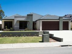  114 Roxburghe Dr The Vines WA 6069 RELAXED LIVING WITH SUPERB GOLF COURSE VIEWS! Your only local Real Estate Office, The Vines Real Estate offers the following quality home in a great location For Sale.  Perfectly configured for relaxed living and outdoor entertaining, this beautifully presented 4 bedroom 2 bathroom home with outlook to golf course and opposite bush reserve has low maintenance gardens and sparkling below ground pool.  Sit back, relax and enjoy the peaceful surrounds!     Decked portico with solid wood double doors Stunning entrance with spot lighting High 31c ceilings in entrance and living areas Marri wood flooring throughout Open plan kitchen/meals/family Versatile study room with frosted glass doors Theatre room with recessed ceilings and mood lighting Chefs kitchen with central stone bench, quality appliances and plenty of storage North facing large master bedroom with walk in robe Resort style ensuite with shower, double vanity, feature tiling and separate toilet 3 further Queensize bedrooms with built in robes Main bathroom with shower and bath Separate guest powder room Large 32.5sqm decked alfresco under main roof with inbuilt kitchen and barbecue Sparkling 9mx4m below ground pool with water feature, decking and glass fence surround Reverse cycle ducted air conditioning, alarm system, solar hot water system, smart wiring, 3 phase power, reticulated front garden and lawn 3 car remote garage and exposed aggregate driveway Living area of 243sqm and 337sqm under main roof Land area of 711sqm 