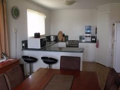  35 Ivy Street  Roma QLD 4455 Looking for that neat and tidy home with nothing to do in a quiet street? then this is it! 3 good size built-in bedrooms, great open plan living areas. Modern kitchen with new stove, pantry, 1 1/2 bowl sink and breakfast bar. Evaporative air conditioning throughout, gas bayonet for heater, fully screened plus security doors, linen and broom cupboards. Rain water tank and large garden shed, 2 bay carport, 6 ft colourbond fencing complete the outside picture. $337,000 