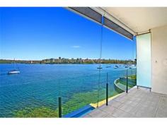  2/11a Oyama Avenue Manly NSW 2095 HARBOURFRONT PARADISE To live on the foreshores of Sydney Harbour, looking across a view-swept swimming pool and beautifully manicured harbourfront lawn, must be the ultimate dream. Just a short stroll from Manly's ferry terminal, at the end of a quiet seaside cul-de-sac, this spacious 2 bedroom Waterfront apartment presents a wonderful Lifestyle opportunity.  Part of a small boutique building, with secure garaging and sandy beaches just footsteps away, this property enjoys breathtaking main harbour views to Forty Baskets Beach and beyond.  The sunny aspect and prime front-row position enjoy a never-ending parade of yachts and pleasure-craft where you'll really have to pinch yourself to believe it's all yours... Seeing is believing ! *** BE SURE TO VIEW OUR AMAZING 2min VIDEO TOUR ONLINE AT maxwalls.com/id178 
