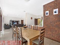  1/2 Gardinia Street Beverly Hills NSW 2209 ENORMOUS BRICK HOME ON 3 LEVELS THE PHOTOS, FLOOR PLAN & DESCRIPTION DO NOT DO THIS PROPERTY JUSTICE - YOUR INSPECTION IS HIGHLY RECOMMENDED TO APPRECIATE THIS TRULY MAGNIFICENT HOME POSSIBLE IN-LAW ACCOMMODATION/GRANNY FLAT 5 LARGE BEDROOMS - 2 KITCHENS - 3 BATHROOMS - OPEN PLAN LOUNGE/DINING AREA - FORMAL LOUNGE ROOM The property is an enormous and extremely well maintained brick home in a very sought after quiet location. There are 3 large bedrooms on the entry level, plus 2 big bedrooms upstairs with built-in wardrobes. There are 3 immaculate bathrooms, one on each level of the house. The main open plan lounge/dining/kitchen area is very spacious with high ceilings and sliding doors that open to a huge verandah (30 sqm Approx.), with a sought after Northerly aspect and very pleasant district views. The kitchen has been tastefully renovated with quality Miele appliances, gas cooking, ducted exhaust, dishwasher, long breakfast bar and plenty of cupboard and bench space. There is a huge granny flat/in-law accommodation on the ground floor with a near new kitchen with gas cooking/ducted exhaust & tastefully renovated bathroom. The granny flat has doors that open to a very large covered entertaining area. The backyard is a good size and low maintenance with a lovely vegetable patch and a sought after & sunny Northerly aspect. There is a wide driveway to a very sheltered double carport with a gate and a door that provides access to the backyard. The property has many sought after features such as a quality built & custom made timber staircase, covered entrance, large entry foyer, wine cellar, lots of extra storage space, ducted air conditioning back to base alarm system, to name a few. VERY RARE OPPORTUNITY TO PURCHASE A VERY SOLID AND SUBSTANTIAL HOME IN THE AREA 