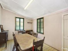  14 Seventh Ave South Townsville QLD 4810 Early 1900's Queenslander Classic!!! Auction Details: Sat 20/12/2014 10:30 AM "Phone for an Inspection". STREET AND 2 LANEWAY ACCESS!!! If there is an Auction you must attend and be an active bidder at this year it will have to be this one. Being held at 10.30am on Saturday 20th December this would be the perfect Christmas present for the family. Structually sound and with the addition of a few modern conveniences you could be in your new home straight away.  Built in the early 1900's this home has a lot of history and has seen some changes along the way with the old timber gidgee post having been replaced with concrete and steel stumps. Also the front verandah has been closed in and turned into a sleepout. The original railings and fancy carved fretwork have been preserved and are covered over making it easy to bring back to the original look. (Refer to the black & white photo)  There are three bedrooms, combined dining and kitchen, separate lounge plus bathroom upstairs with a separate toilet. Downstairs is lockable with room for one car, plenty of workshop space, laundry and a second toilet.  