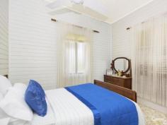  14 Seventh Ave South Townsville QLD 4810 Early 1900's Queenslander Classic!!! Auction Details: Sat 20/12/2014 10:30 AM "Phone for an Inspection". STREET AND 2 LANEWAY ACCESS!!! If there is an Auction you must attend and be an active bidder at this year it will have to be this one. Being held at 10.30am on Saturday 20th December this would be the perfect Christmas present for the family. Structually sound and with the addition of a few modern conveniences you could be in your new home straight away.  Built in the early 1900's this home has a lot of history and has seen some changes along the way with the old timber gidgee post having been replaced with concrete and steel stumps. Also the front verandah has been closed in and turned into a sleepout. The original railings and fancy carved fretwork have been preserved and are covered over making it easy to bring back to the original look. (Refer to the black & white photo)  There are three bedrooms, combined dining and kitchen, separate lounge plus bathroom upstairs with a separate toilet. Downstairs is lockable with room for one car, plenty of workshop space, laundry and a second toilet.  