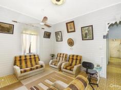  14 Seventh Ave South Townsville QLD 4810 Early 1900's Queenslander Classic!!! Auction Details: Sat 20/12/2014 10:30 AM "Phone for an Inspection". STREET AND 2 LANEWAY ACCESS!!! If there is an Auction you must attend and be an active bidder at this year it will have to be this one. Being held at 10.30am on Saturday 20th December this would be the perfect Christmas present for the family. Structually sound and with the addition of a few modern conveniences you could be in your new home straight away.  Built in the early 1900's this home has a lot of history and has seen some changes along the way with the old timber gidgee post having been replaced with concrete and steel stumps. Also the front verandah has been closed in and turned into a sleepout. The original railings and fancy carved fretwork have been preserved and are covered over making it easy to bring back to the original look. (Refer to the black & white photo)  There are three bedrooms, combined dining and kitchen, separate lounge plus bathroom upstairs with a separate toilet. Downstairs is lockable with room for one car, plenty of workshop space, laundry and a second toilet.  