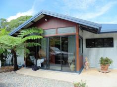  12 Fallon Rd Kuranda QLD 4881 $595,000 QUALITY HOME ON 1 ACRE House - Property ID: 775637 POTENTIAL TO BUILD GARDEN FLAT UNDER HOUSE o 	 Master Bedroom with ensuite and walk in robe o 	 Two other large bedrooms with built in robes o 	 Large open plan kitchen, dining, living area o 	 Sunroom at entrance of home o 	 Sloping block with terraced gardens o 	 Circular Driveway with level entrance to home o 	 Height under house tall enough for Mobile home o 	 Well appointed kitchen with walk in pantry This fabulous 293 sq mtr home has many wonderful features such as large sliding windows and doors in the living area that retract back to give a feeling of indoor / outdoor balcony living. This area expands onto a large undercover north facing verandah. The home is 7 years old and been kept in immaculate condition. The property originally came with an in ground pool that was not required by the current owners. This area has been filled with soil and transformed into a lovely lawned area. The pool can be reverted back to its original state as all plumbing is still in place. A great deal of thought and work has gone into ensuring that the property is well drained. The slope of the land is terraced with rock walls and a large variety of plant species. Privacy is assured as this home cannot be seen from the street and only has 1 neighbour.  Print Brochure Email Alerts Features  Building Size Approx. - 293 m2  Land Size Approx. - 4054 m2  3 Bed 3 Bath  Landscape gardens  potential for granny flat  large undercover deck  Large open plan kitchen  master with ensuite 
