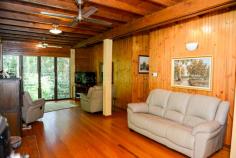  1 Gregory Terrace Kuranda QLD 4881 $575,000 negotiable Emaculate Pole Home in the Rainforest House - Property ID: 772920 This beautifully maintained timber pole home is situated on 1 acre within Kuranda's premiere Top of the Range rainforest estate. Surrounded by lush tropical, landscaped gardens and rainforest trees, this is a very private residence with electric gate entrance. Imagine starting your day with breakfast on the balcony amongst the birds, watching wallabies graze below. Sunset drinks on the front balcony finishes off the day nicely! Timber floors throughout, except the kitchen which has tiles on the floor. There are 4 bedrooms on 3 levels. Upstairs are 2 bedrooms and a bathroom, with a large living area perfect as a kids retreat or TV room. Mum and Dad's main bedroom on the middle level has a great en-suite with rainforest views.  The ground level had a bedroom and laundry with a loo, which could easily be converted to a granny flat or makes great accommodation for visiting relatives. There is nothing to do here! Just move right in and enjoy the rainforest lifestyle!   Print Brochure Email Alerts Features  Land Size Approx. - 4186 m2  Private rainforest block  1 acre Tropical gardens  Lots of storage  4 car parks  4 bedrooms  Large kitchen 