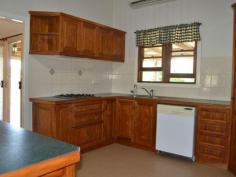  22 Meson Street Gayndah Qld 4625 $275,000 Beautifully Restored Queenslander - Entertainers Delight * 4 good sized bedrooms - 2 with walk in dressing rooms * Returning $285 p/w on a long term lease * Beautiful timber kitchen with ample bench space, dishwasher, gas cooktop + servery * Huge entertaining deck overlooking the back yard * Bathroom features shower over bath & linen cupboard * Polished wooden floors in lounge & front entry room * 3 reverse cycle A/C + ceiling fans * Large 1,363m2 allotment - plenty of room to watch the kids play from the back deck * Centrally located - stone throw away from schools and shops   Property Snapshot  Property Type: House Land Area: 1,363 m2 