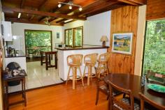  1 Gregory Terrace Kuranda QLD 4881 $575,000 negotiable Emaculate Pole Home in the Rainforest House - Property ID: 772920 This beautifully maintained timber pole home is situated on 1 acre within Kuranda's premiere Top of the Range rainforest estate. Surrounded by lush tropical, landscaped gardens and rainforest trees, this is a very private residence with electric gate entrance. Imagine starting your day with breakfast on the balcony amongst the birds, watching wallabies graze below. Sunset drinks on the front balcony finishes off the day nicely! Timber floors throughout, except the kitchen which has tiles on the floor. There are 4 bedrooms on 3 levels. Upstairs are 2 bedrooms and a bathroom, with a large living area perfect as a kids retreat or TV room. Mum and Dad's main bedroom on the middle level has a great en-suite with rainforest views.  The ground level had a bedroom and laundry with a loo, which could easily be converted to a granny flat or makes great accommodation for visiting relatives. There is nothing to do here! Just move right in and enjoy the rainforest lifestyle!   Print Brochure Email Alerts Features  Land Size Approx. - 4186 m2  Private rainforest block  1 acre Tropical gardens  Lots of storage  4 car parks  4 bedrooms  Large kitchen 