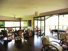  12 Fallon Rd Kuranda QLD 4881 $595,000 QUALITY HOME ON 1 ACRE House - Property ID: 775637 POTENTIAL TO BUILD GARDEN FLAT UNDER HOUSE o 	 Master Bedroom with ensuite and walk in robe o 	 Two other large bedrooms with built in robes o 	 Large open plan kitchen, dining, living area o 	 Sunroom at entrance of home o 	 Sloping block with terraced gardens o 	 Circular Driveway with level entrance to home o 	 Height under house tall enough for Mobile home o 	 Well appointed kitchen with walk in pantry This fabulous 293 sq mtr home has many wonderful features such as large sliding windows and doors in the living area that retract back to give a feeling of indoor / outdoor balcony living. This area expands onto a large undercover north facing verandah. The home is 7 years old and been kept in immaculate condition. The property originally came with an in ground pool that was not required by the current owners. This area has been filled with soil and transformed into a lovely lawned area. The pool can be reverted back to its original state as all plumbing is still in place. A great deal of thought and work has gone into ensuring that the property is well drained. The slope of the land is terraced with rock walls and a large variety of plant species. Privacy is assured as this home cannot be seen from the street and only has 1 neighbour.  Print Brochure Email Alerts Features  Building Size Approx. - 293 m2  Land Size Approx. - 4054 m2  3 Bed 3 Bath  Landscape gardens  potential for granny flat  large undercover deck  Large open plan kitchen  master with ensuite 