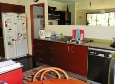 12 Fallon Rd Kuranda QLD 4881 $595,000 QUALITY HOME ON 1 ACRE House - Property ID: 775637 POTENTIAL TO BUILD GARDEN FLAT UNDER HOUSE o 	 Master Bedroom with ensuite and walk in robe o 	 Two other large bedrooms with built in robes o 	 Large open plan kitchen, dining, living area o 	 Sunroom at entrance of home o 	 Sloping block with terraced gardens o 	 Circular Driveway with level entrance to home o 	 Height under house tall enough for Mobile home o 	 Well appointed kitchen with walk in pantry This fabulous 293 sq mtr home has many wonderful features such as large sliding windows and doors in the living area that retract back to give a feeling of indoor / outdoor balcony living. This area expands onto a large undercover north facing verandah. The home is 7 years old and been kept in immaculate condition. The property originally came with an in ground pool that was not required by the current owners. This area has been filled with soil and transformed into a lovely lawned area. The pool can be reverted back to its original state as all plumbing is still in place. A great deal of thought and work has gone into ensuring that the property is well drained. The slope of the land is terraced with rock walls and a large variety of plant species. Privacy is assured as this home cannot be seen from the street and only has 1 neighbour.  Print Brochure Email Alerts Features  Building Size Approx. - 293 m2  Land Size Approx. - 4054 m2  3 Bed 3 Bath  Landscape gardens  potential for granny flat  large undercover deck  Large open plan kitchen  master with ensuite 
