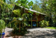  1 Gregory Terrace Kuranda QLD 4881 $575,000 negotiable Emaculate Pole Home in the Rainforest House - Property ID: 772920 This beautifully maintained timber pole home is situated on 1 acre within Kuranda's premiere Top of the Range rainforest estate. Surrounded by lush tropical, landscaped gardens and rainforest trees, this is a very private residence with electric gate entrance. Imagine starting your day with breakfast on the balcony amongst the birds, watching wallabies graze below. Sunset drinks on the front balcony finishes off the day nicely! Timber floors throughout, except the kitchen which has tiles on the floor. There are 4 bedrooms on 3 levels. Upstairs are 2 bedrooms and a bathroom, with a large living area perfect as a kids retreat or TV room. Mum and Dad's main bedroom on the middle level has a great en-suite with rainforest views.  The ground level had a bedroom and laundry with a loo, which could easily be converted to a granny flat or makes great accommodation for visiting relatives. There is nothing to do here! Just move right in and enjoy the rainforest lifestyle!   Print Brochure Email Alerts Features  Land Size Approx. - 4186 m2  Private rainforest block  1 acre Tropical gardens  Lots of storage  4 car parks  4 bedrooms  Large kitchen 